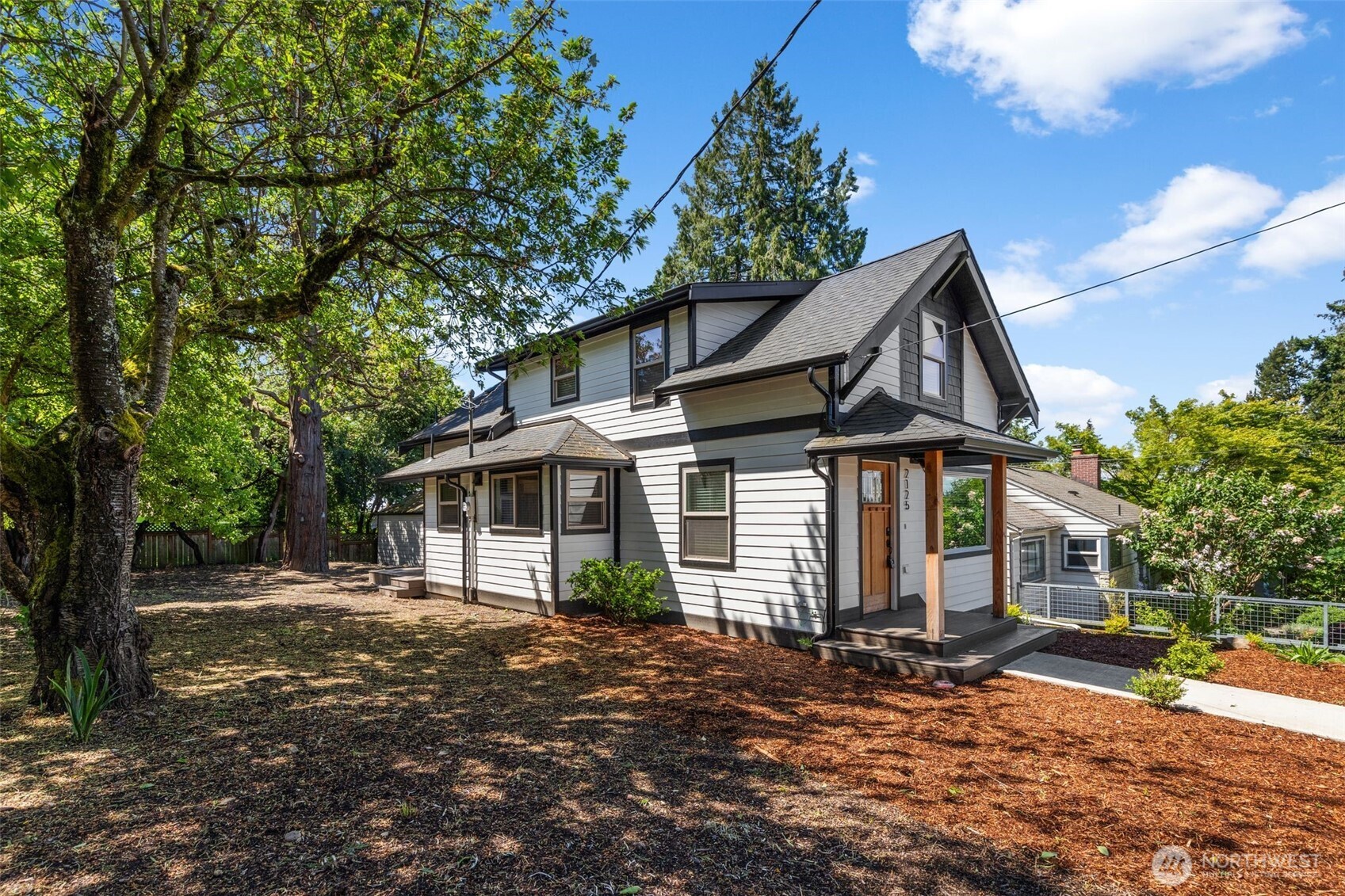 2125 North 90th Street Seattle, WA 98103 - Photo 29 of 29 a front view of a house with a garden