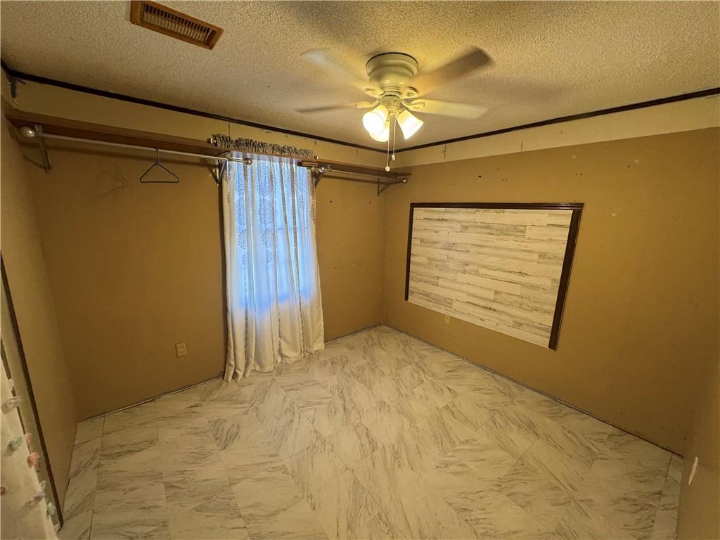 524 Pink Williams Road Dahlonega, GA 30533 - Photo 14 of 39 a view of an empty room with a chandelier fan
