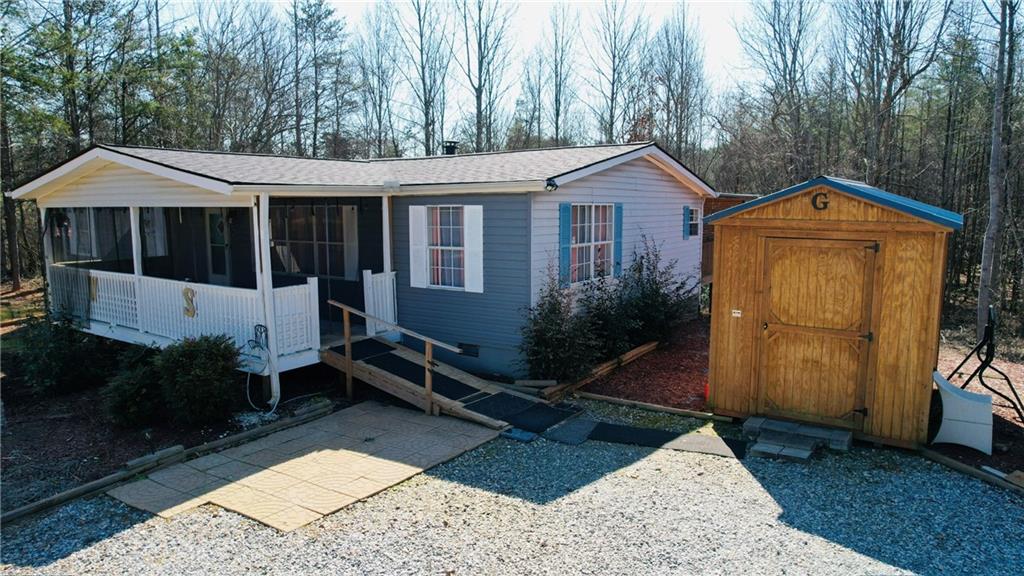 524 Pink Williams Road Dahlonega, GA 30533 - Photo 2 of 39 a front view of a house with garden