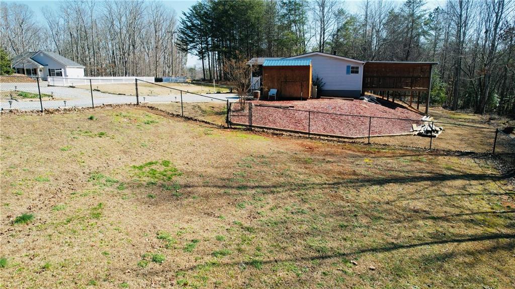 524 Pink Williams Road Dahlonega, GA 30533 - Photo 32 of 39 a backyard of a house with table and chairs