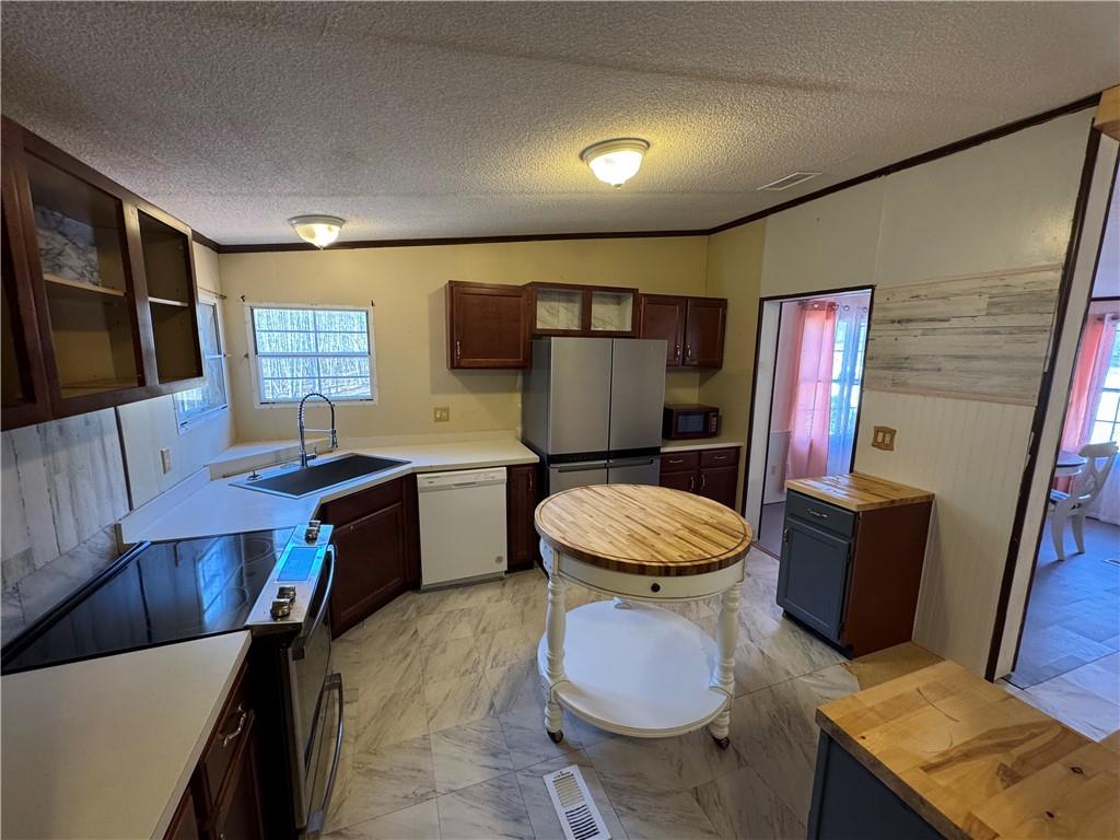 524 Pink Williams Road Dahlonega, GA 30533 - Photo 5 of 39 a bathroom with a granite countertop toilet sink and mirror