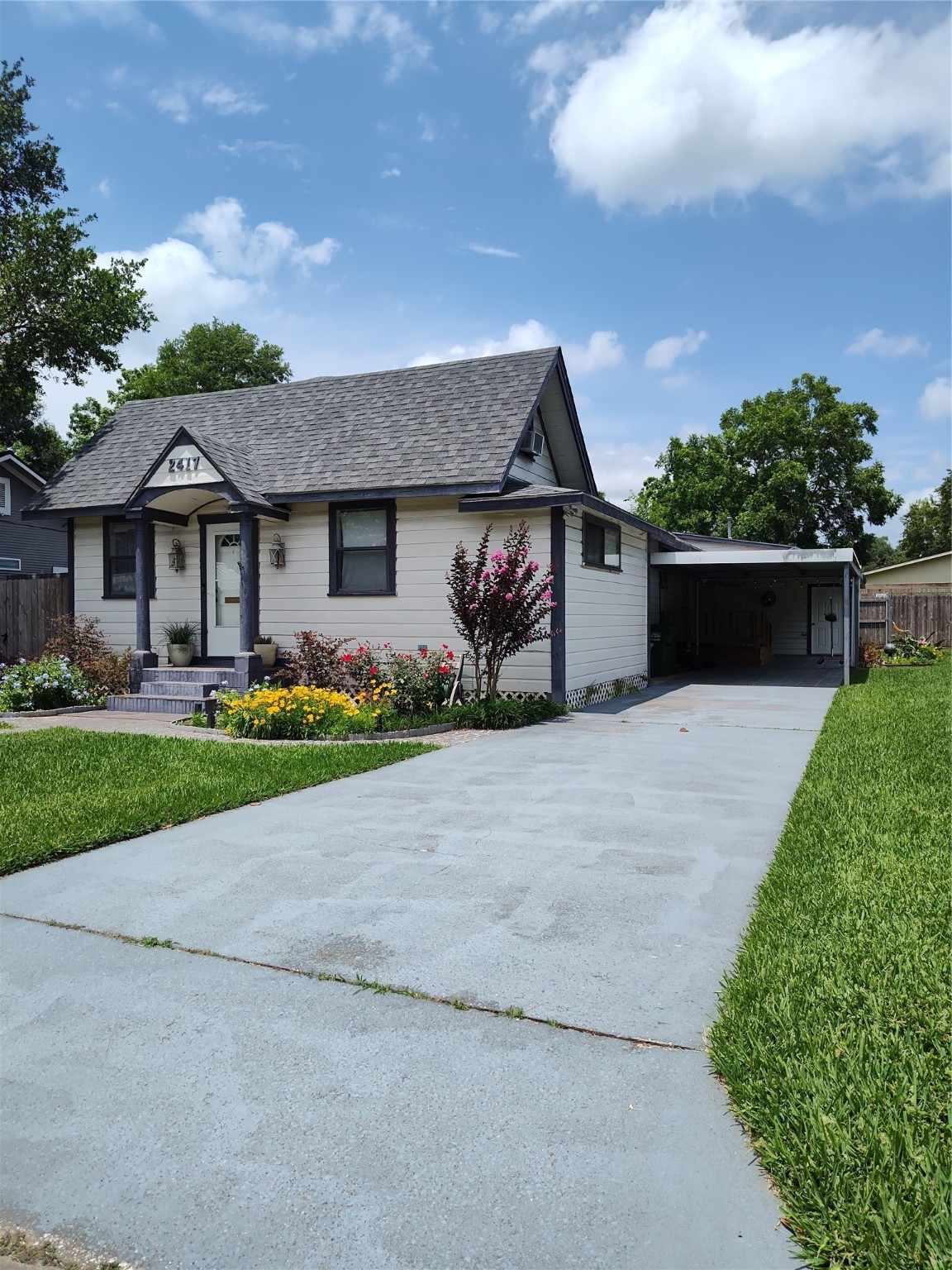 2417 Cos Street Liberty, TX 77575 - Photo 3 of 9 a front view of house with yard and green space