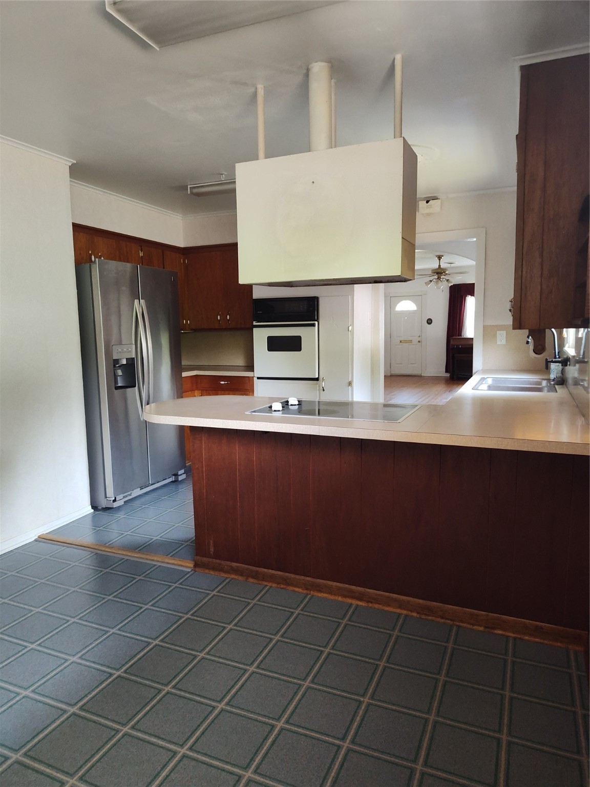 2417 Cos Street Liberty, TX 77575 - Photo 4 of 9 a kitchen with stainless steel appliances a sink stove and refrigerator