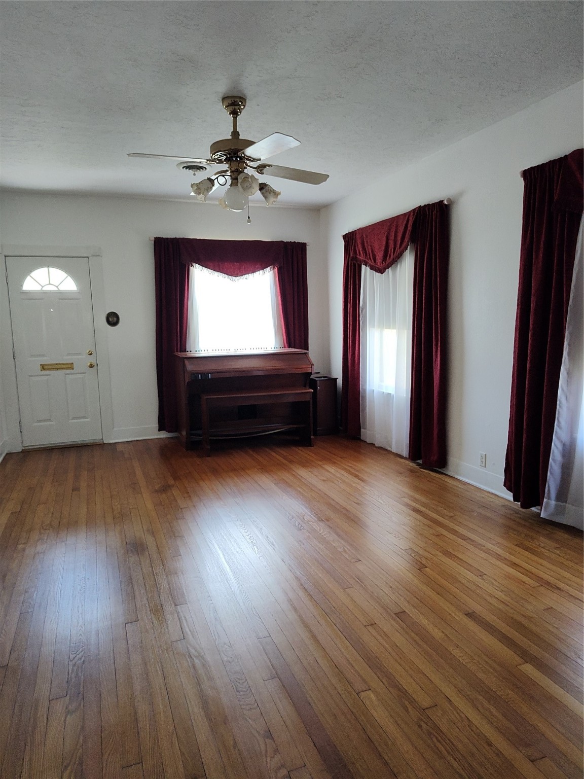 2417 Cos Street Liberty, TX 77575 - Photo 5 of 9 a view of empty room with wooden floor and fan
