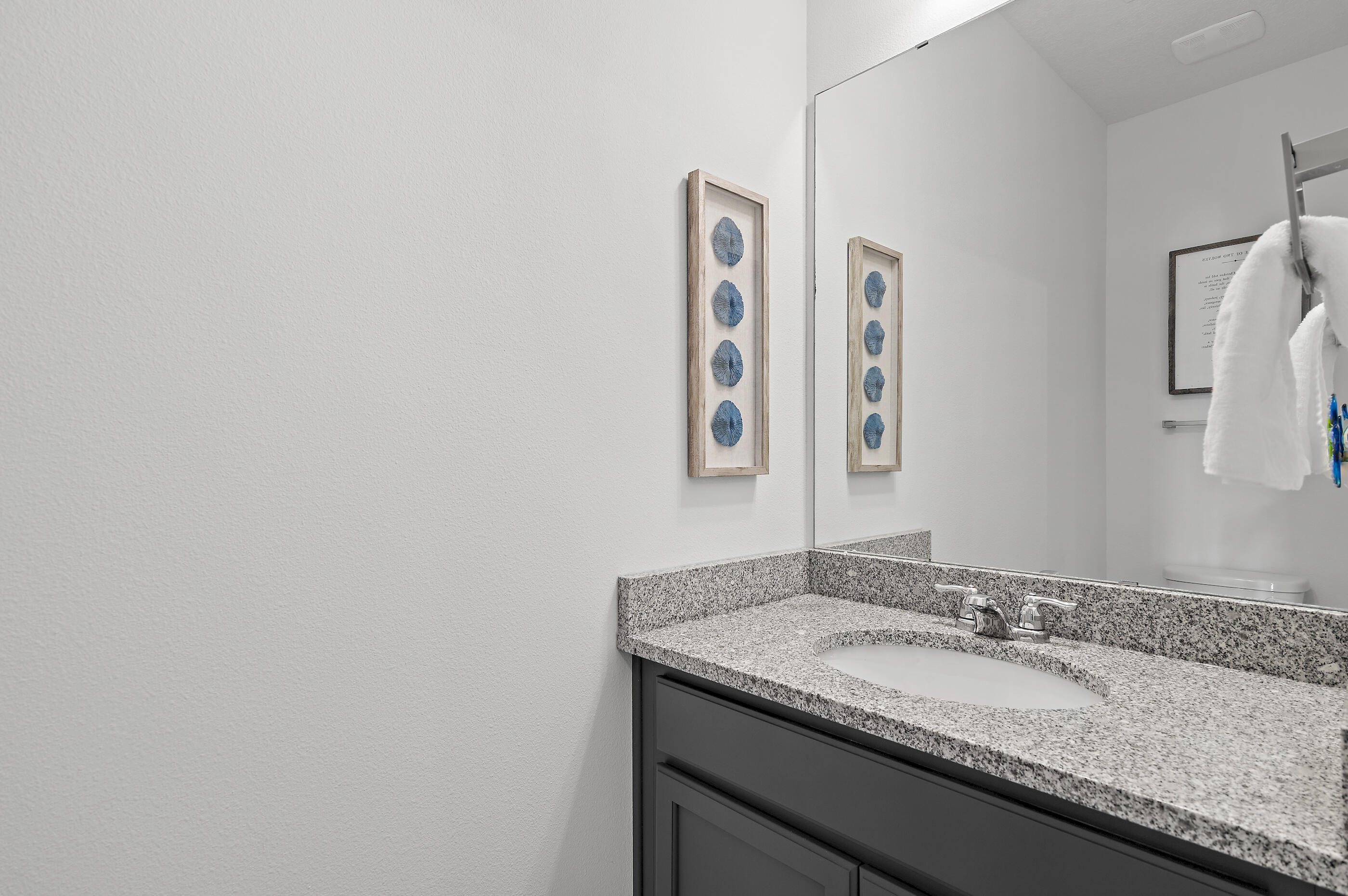 288 Robert Ellis Street Santa Rosa Beach, FL 32459 - Photo 36 of 61 a bathroom with a granite countertop sink and a mirror