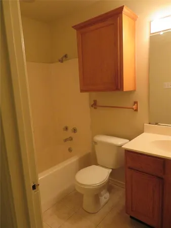 a bathroom with a toilet a sink and bathtub