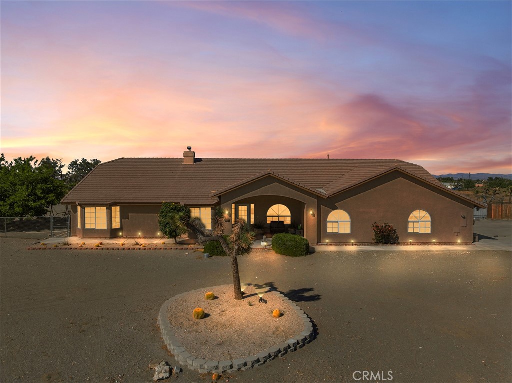 11025 El Esteban Road Phelan, CA 92371 - Photo 2 of 54 a front view of a house with a yard