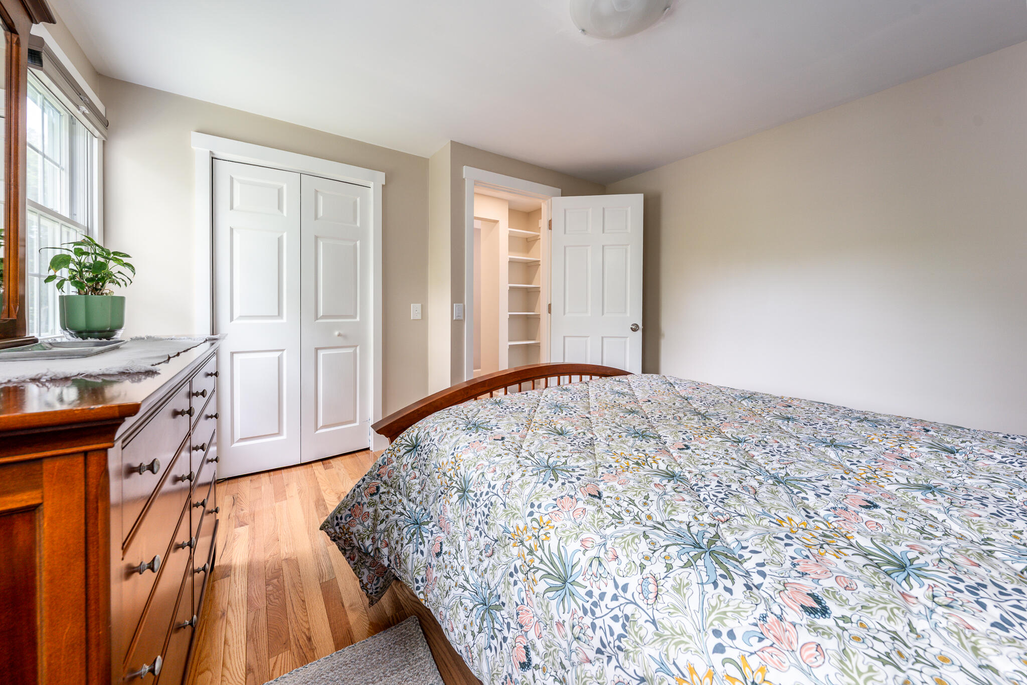 61 Angus Way Centerville, MA 02632 - Photo 30 of 59 a view of a livingroom with wooden floor and a bedroom