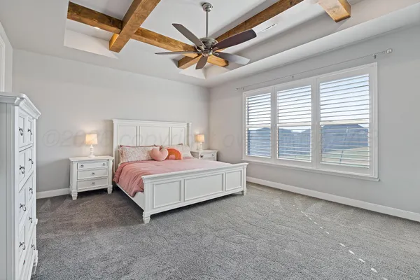 a bedroom with a bed and a cabinets