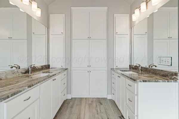 a spacious bathroom with a bathtub and shower