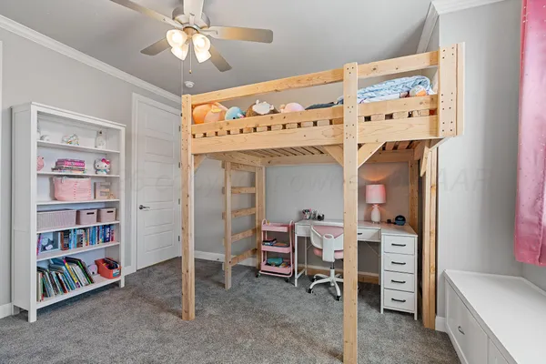 a view of a hallway with wooden floor and a bathroom