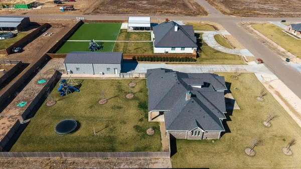a bathroom with a sink a mirror and a shower