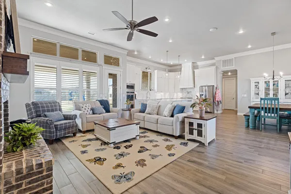a living room with furniture fireplace and a window
