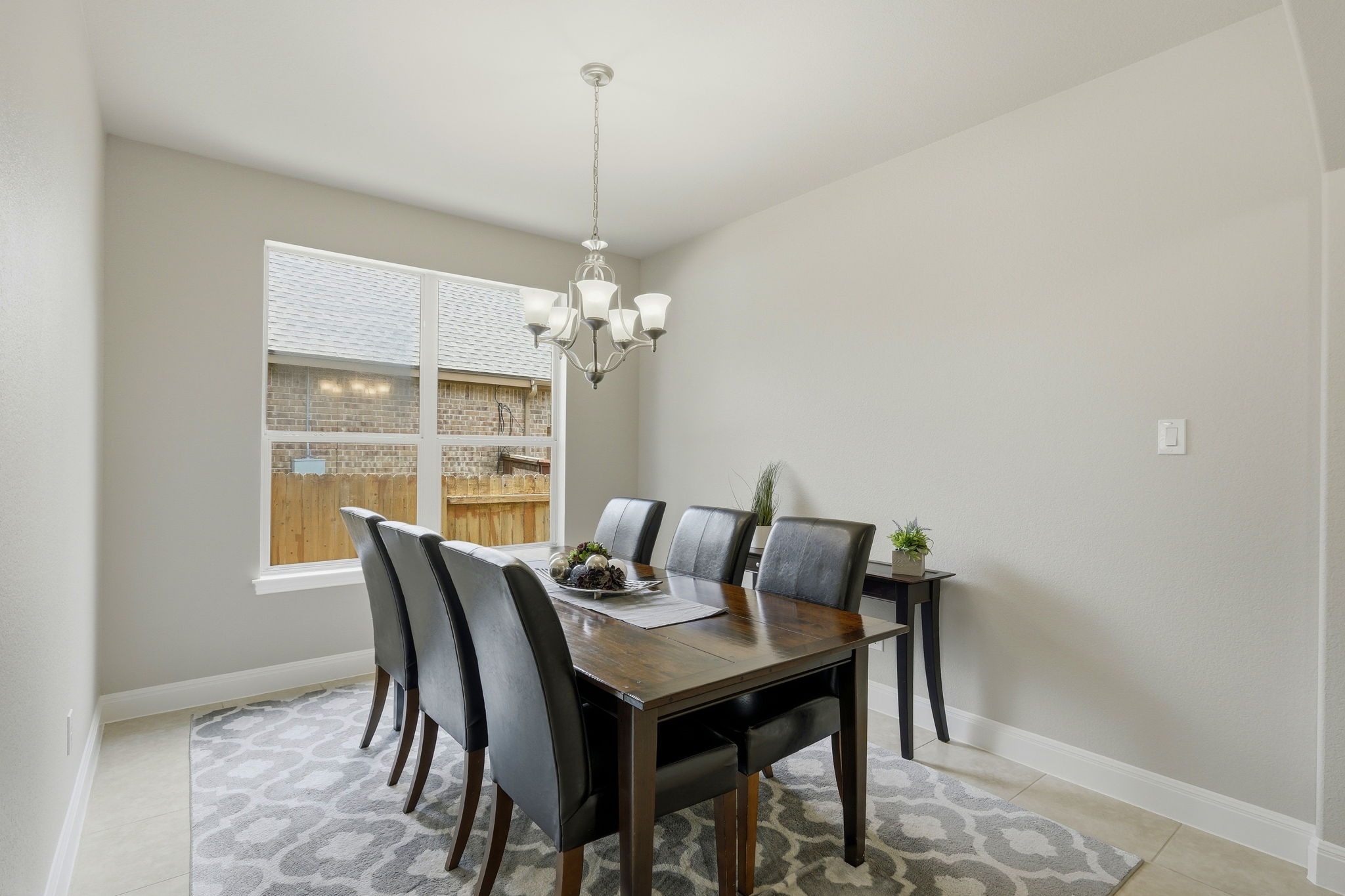 110 Dasher Drive Cedar Park, TX 78613 - Photo 14 of 39 Elegant chandelier illuminates this welcoming dining space, ideal for memorable gatherings.