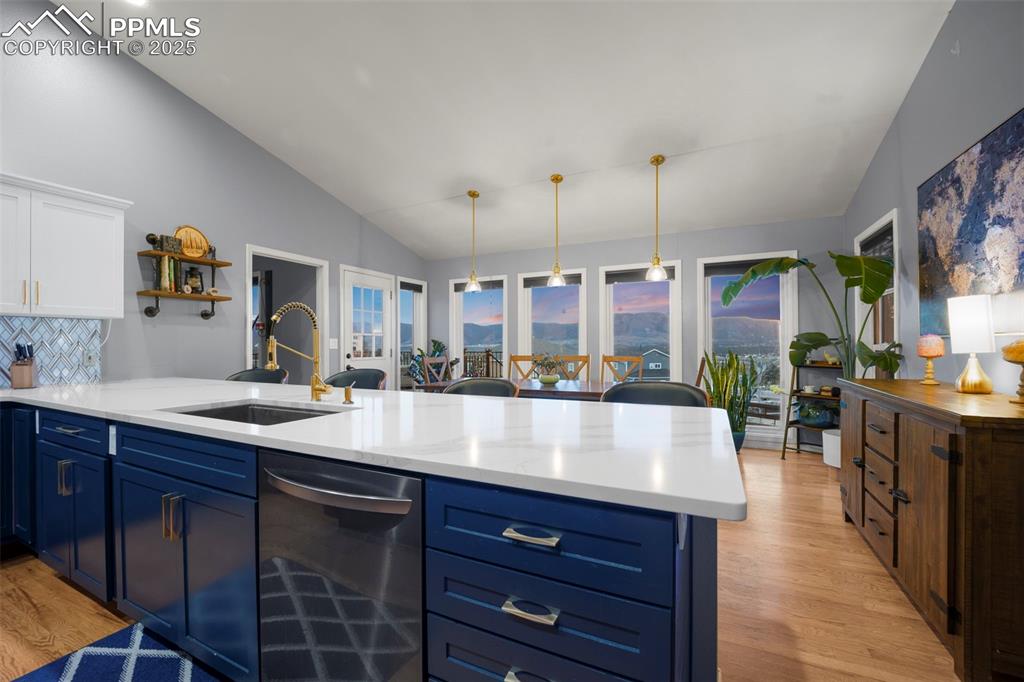 17810 New London Road Monument, CO 80132 - Photo 15 of 50 a living room with stainless steel appliances granite countertop a sink a counter space and cabinets