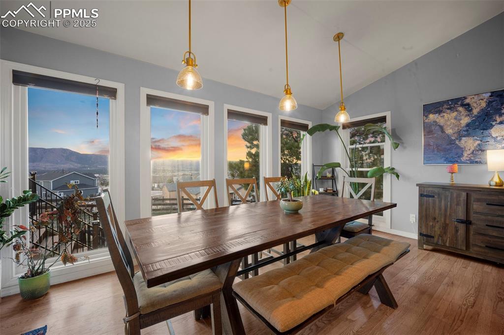 17810 New London Road Monument, CO 80132 - Photo 23 of 50 a view of a dining room and livingroom with furniture wooden floor a chandelier