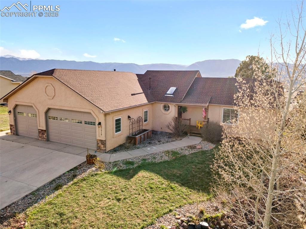 17810 New London Road Monument, CO 80132 - Photo 3 of 50 an aerial view of a house with a yard