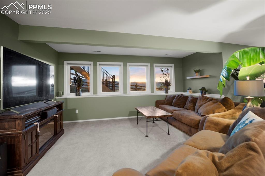 17810 New London Road Monument, CO 80132 - Photo 43 of 50 a living room with furniture and a flat screen tv