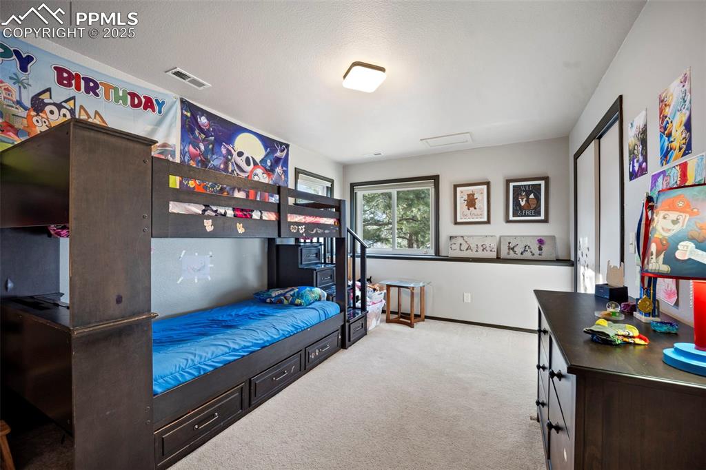 17810 New London Road Monument, CO 80132 - Photo 46 of 50 a living room with furniture and a flat screen tv