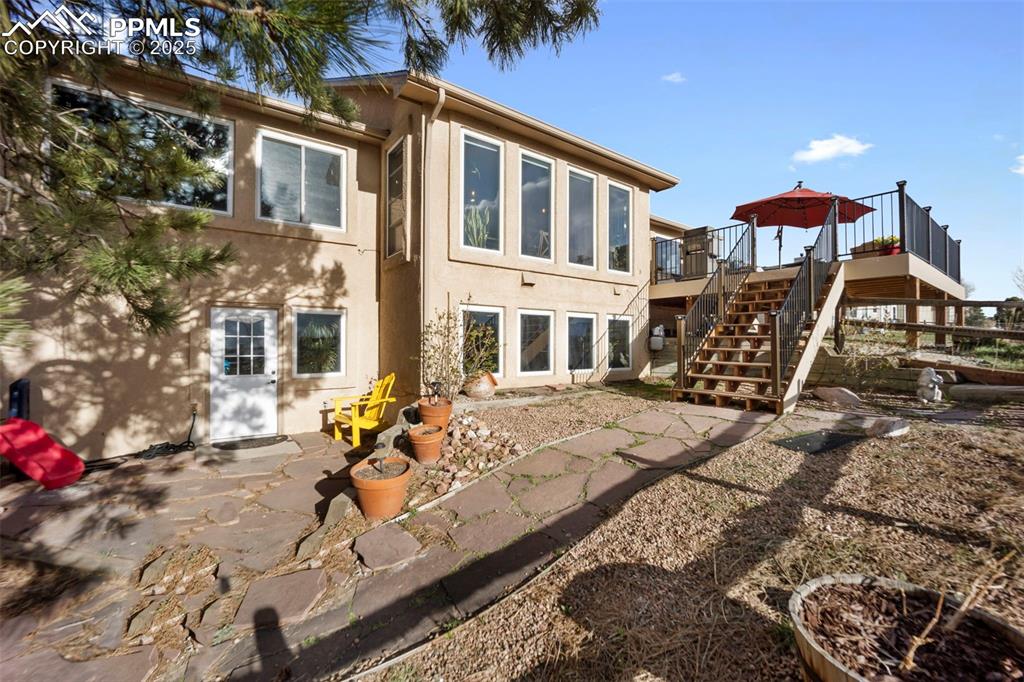 17810 New London Road Monument, CO 80132 - Photo 7 of 50 a view of a house with backyard