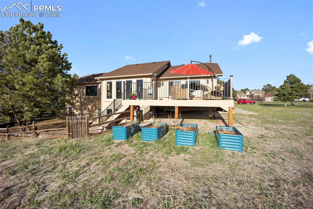 17810 New London Road Monument, CO 80132 - Photo 8 of 50 a view of a house with pool and chairs