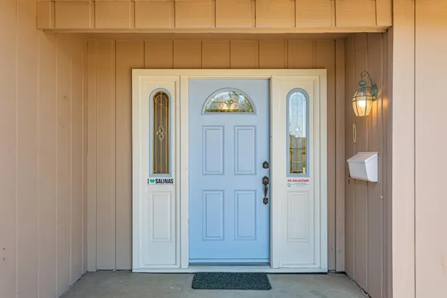 a view of a door with washer and dryer