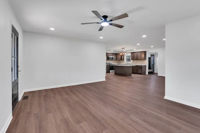 a view of kitchen with wooden floor