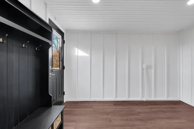 a view of a room with a window and chandelier