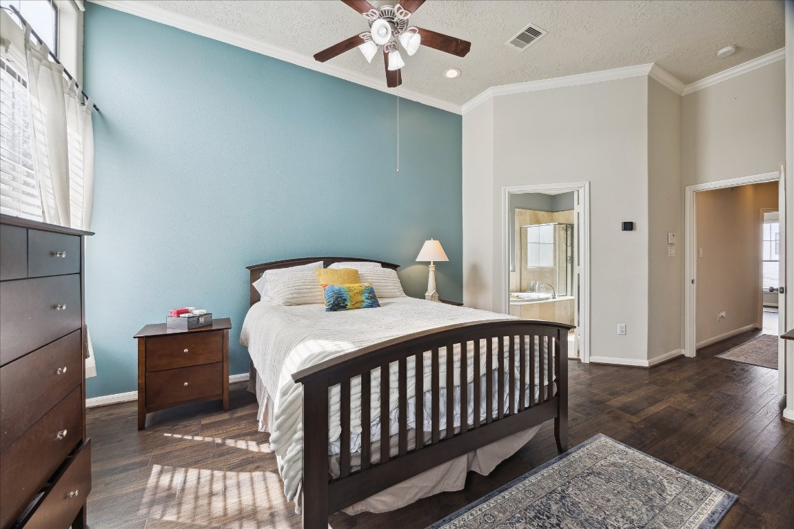 1110 West 25th Street Houston, TX 77008 - Photo 21 of 40 a bedroom with a bed and wooden floor