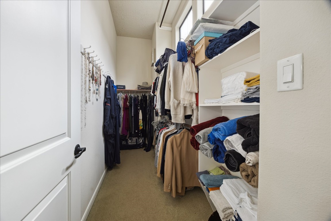 1110 West 25th Street Houston, TX 77008 - Photo 24 of 40 a view of walk in closet with clothes and shoes
