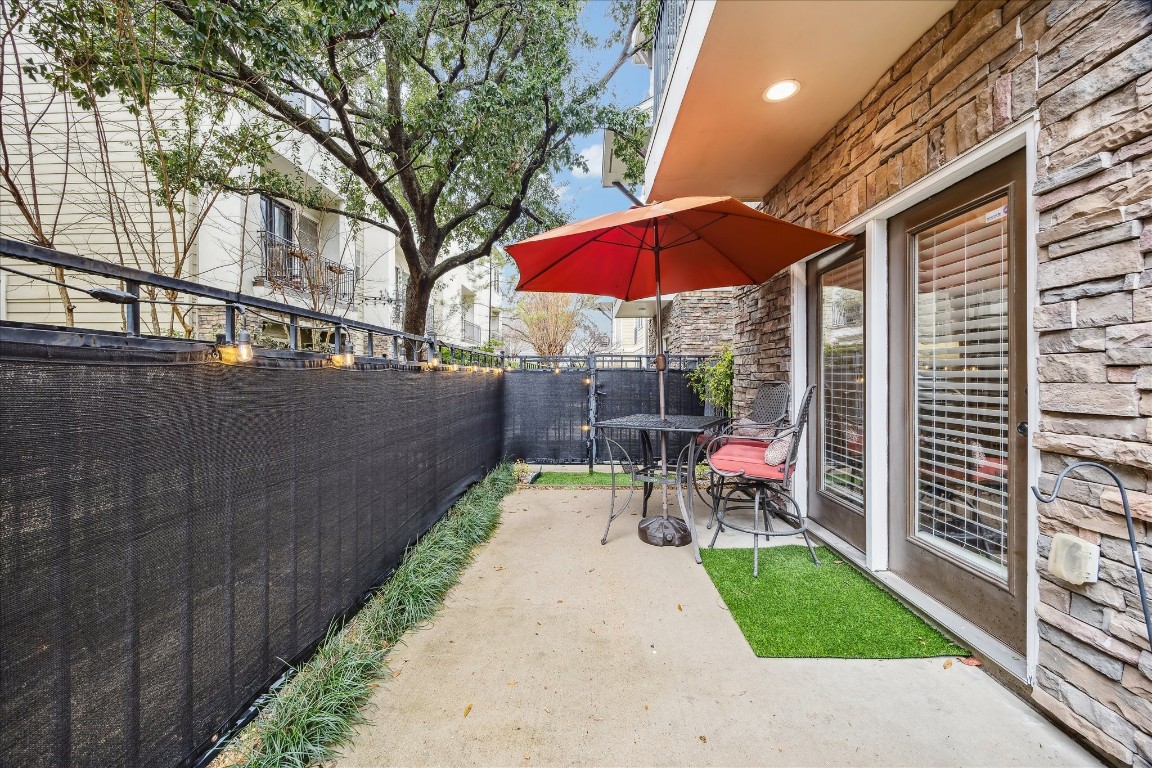 1110 West 25th Street Houston, TX 77008 - Photo 5 of 40 a view of a patio with a table and chairs under an umbrella