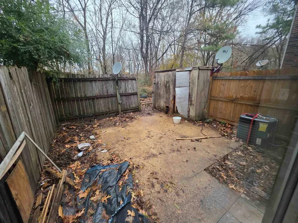 a view of a backyard of the house