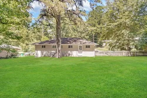 a view of a house with a big yard