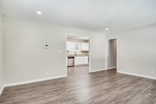 3645 Larkspur Terrace Decatur, GA 30032 - Photo 14 of 25 a view of an empty room with wooden floor and a window