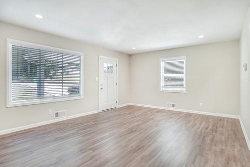3645 Larkspur Terrace Decatur, GA 30032 - Photo 16 of 25 an empty room with wooden floor and windows