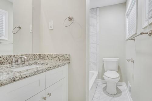 3645 Larkspur Terrace Decatur, GA 30032 - Photo 8 of 25 a bathroom with a granite countertop sink and a toilet