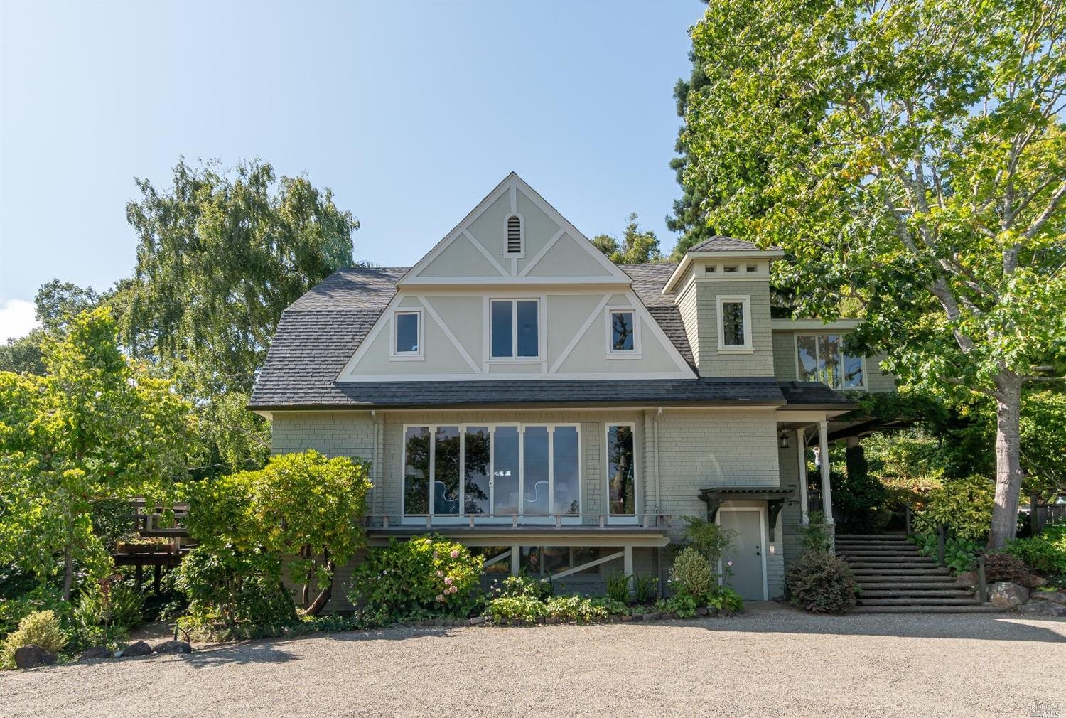 a front view of a house with garden