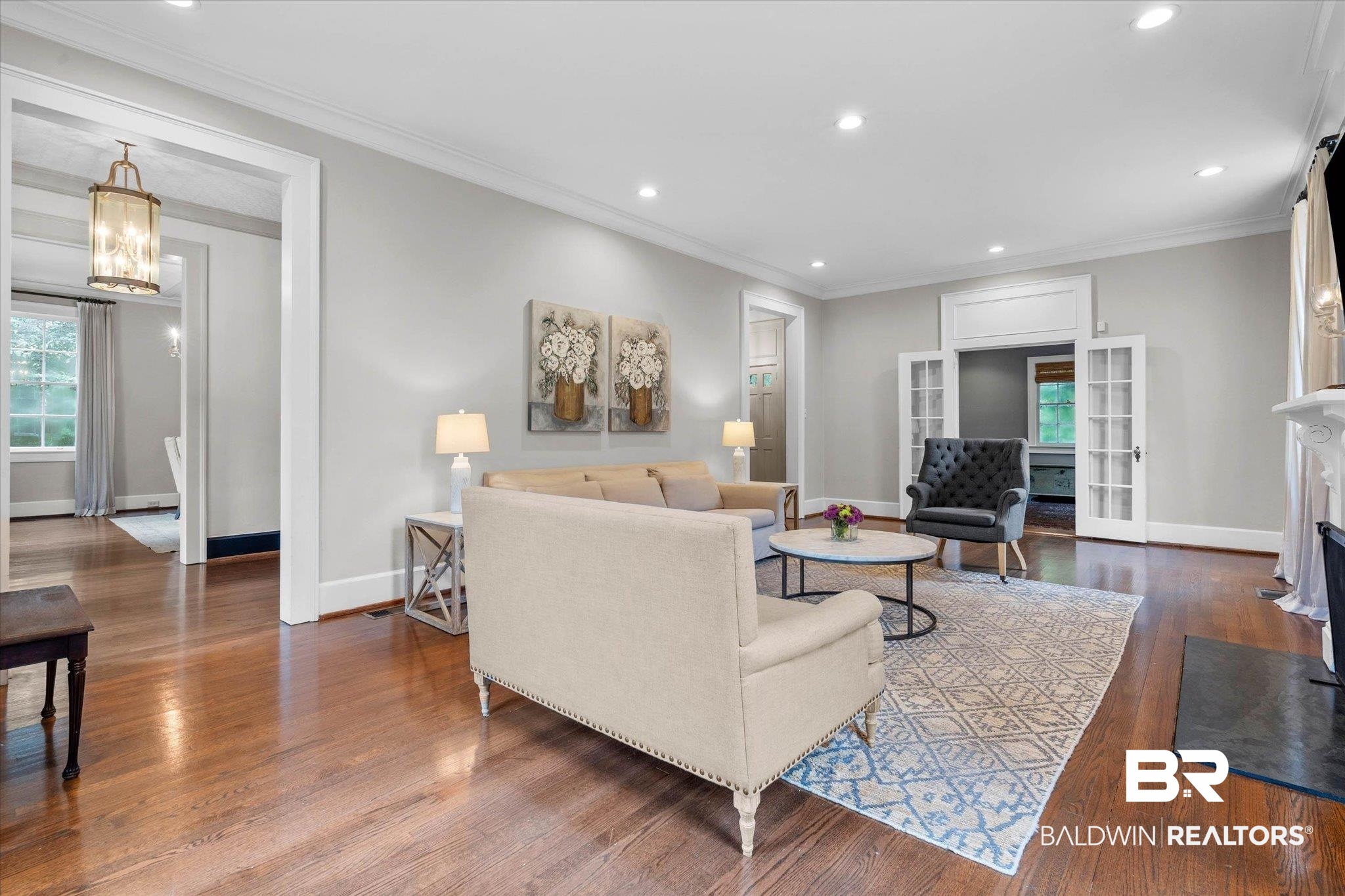3863 Old Shell Road Mobile, AL 36608 - Photo 4 of 48 Spacious living area featuring polished wood flooring, recessed lighting, and a white mantel