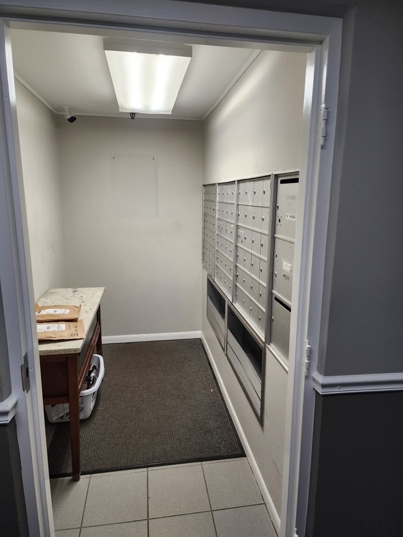 235 North Mill Road, Unit 106B Addison, IL 60101 - Photo 18 of 22 a view of a hallway with washer and dryer