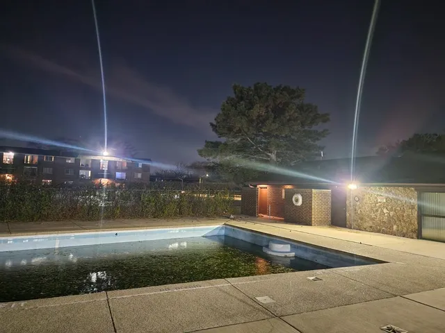 a view of a hallway with a washer and dryer