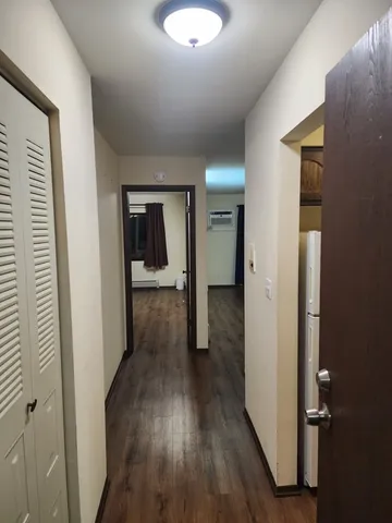 a view of a hallway with seating area