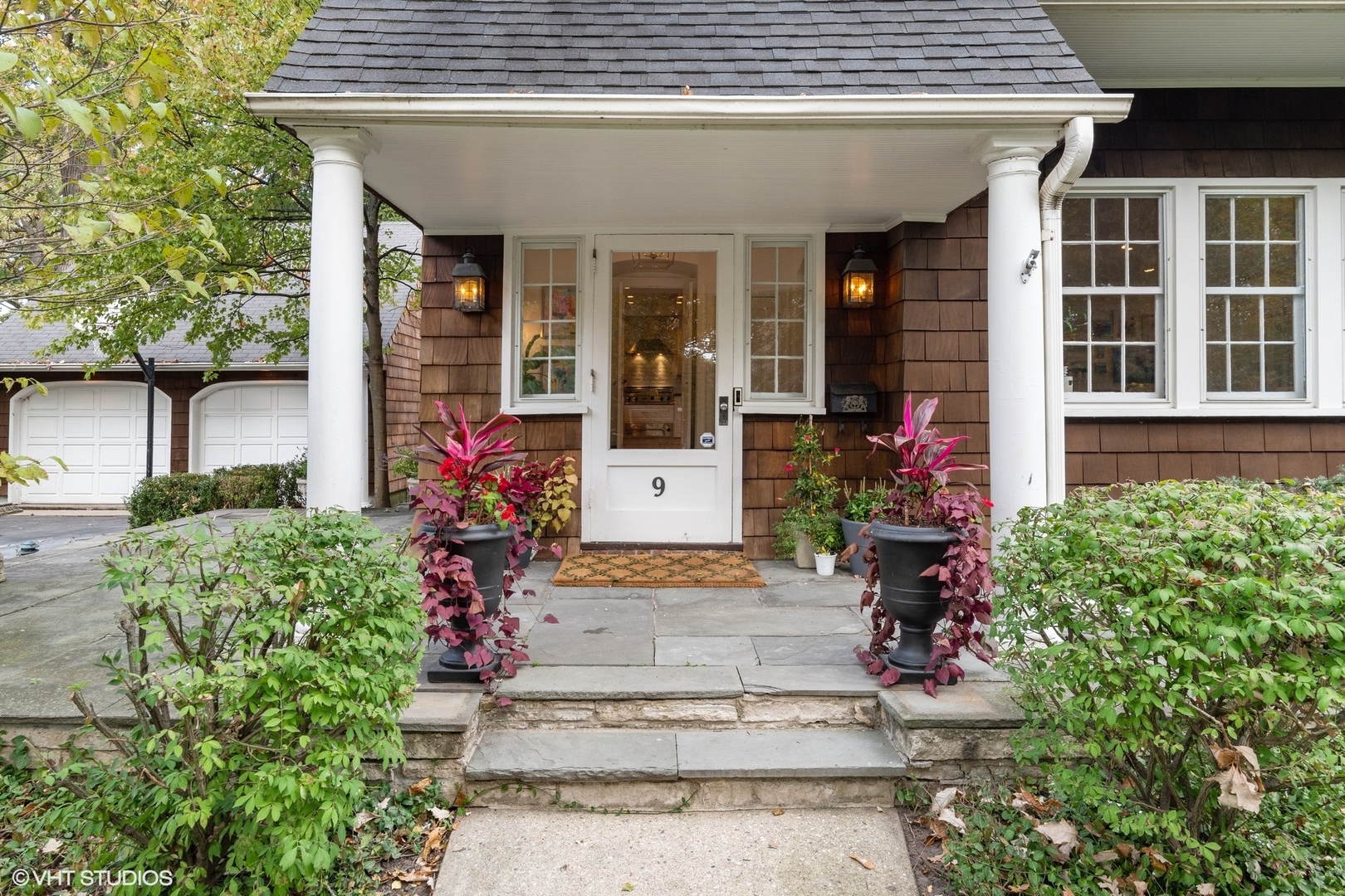 9 Warwick Road Winnetka, IL 60093 - Photo 2 of 54 front view of a house with potted plants
