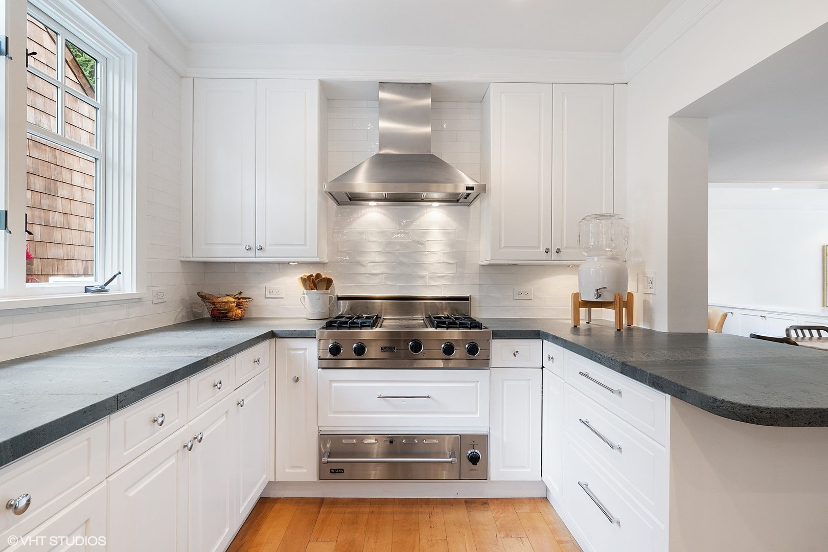 9 Warwick Road Winnetka, IL 60093 - Photo 14 of 54 a kitchen with white cabinets and appliances