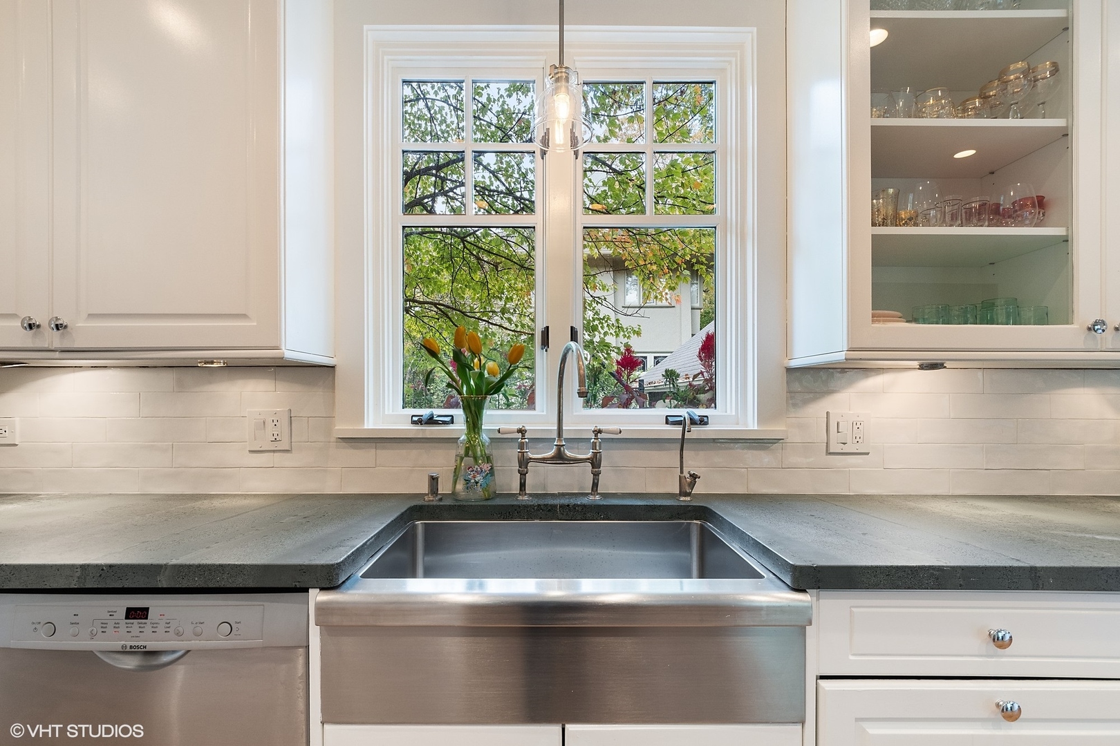 9 Warwick Road Winnetka, IL 60093 - Photo 16 of 54 a kitchen with granite countertop a sink and a window
