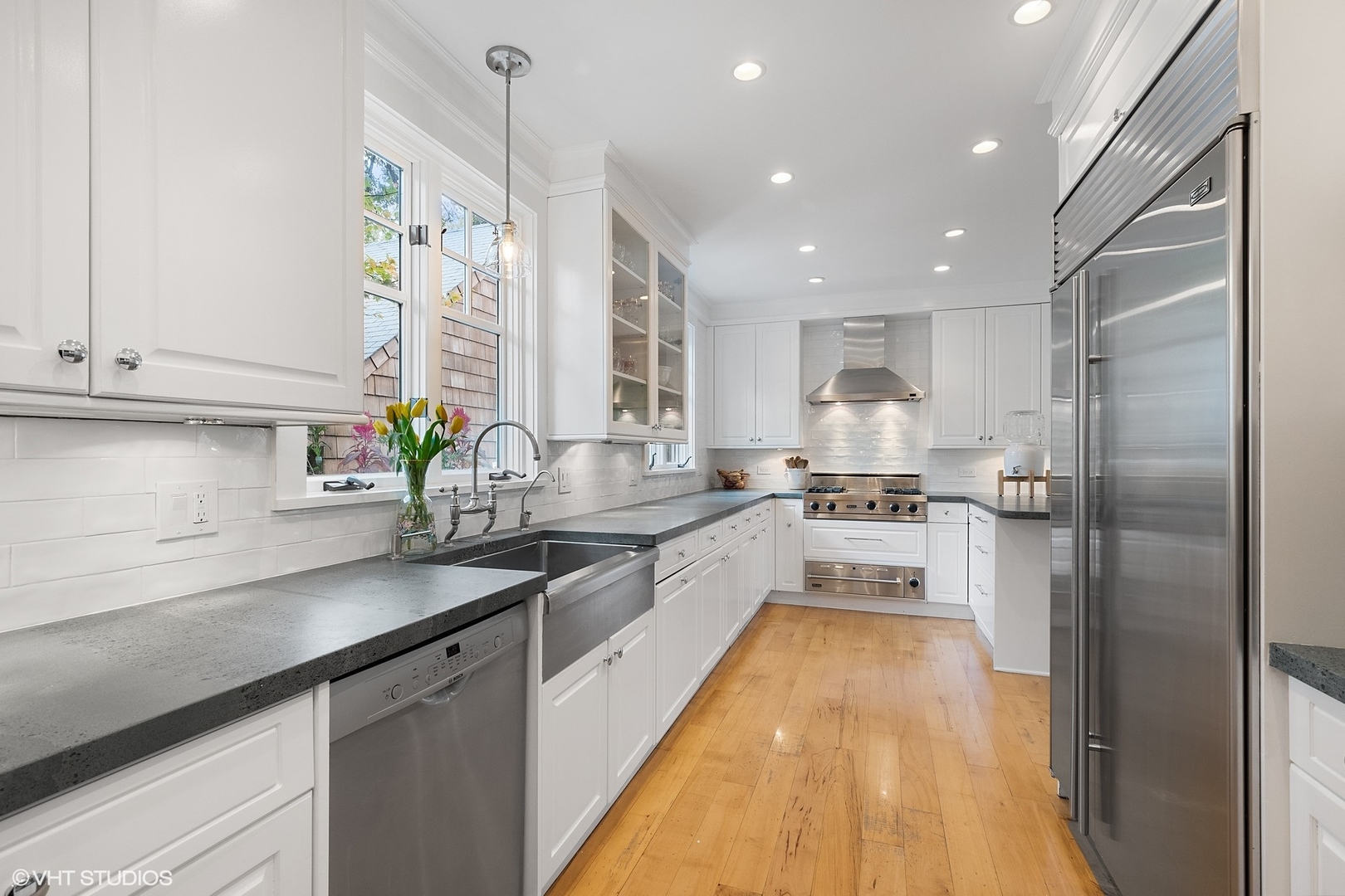 9 Warwick Road Winnetka, IL 60093 - Photo 17 of 54 a kitchen with white cabinets and appliances