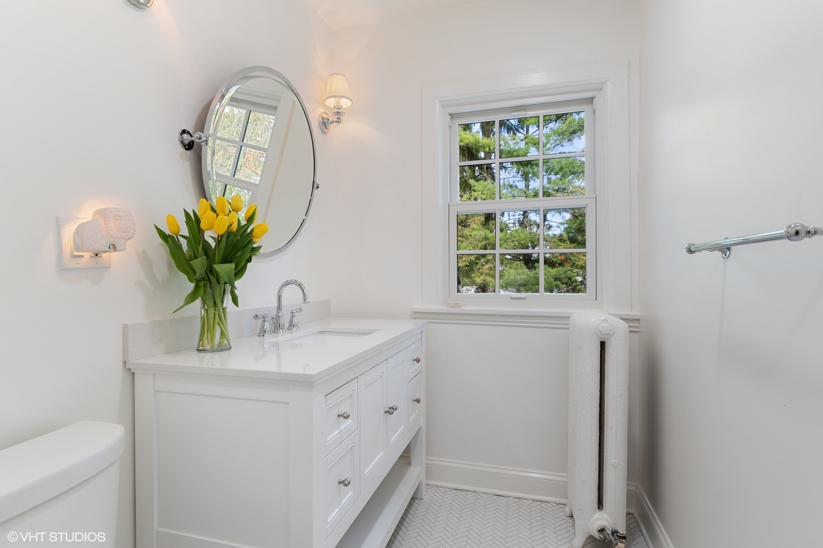 9 Warwick Road Winnetka, IL 60093 - Photo 40 of 54 a bathroom with a sink a mirror and a window