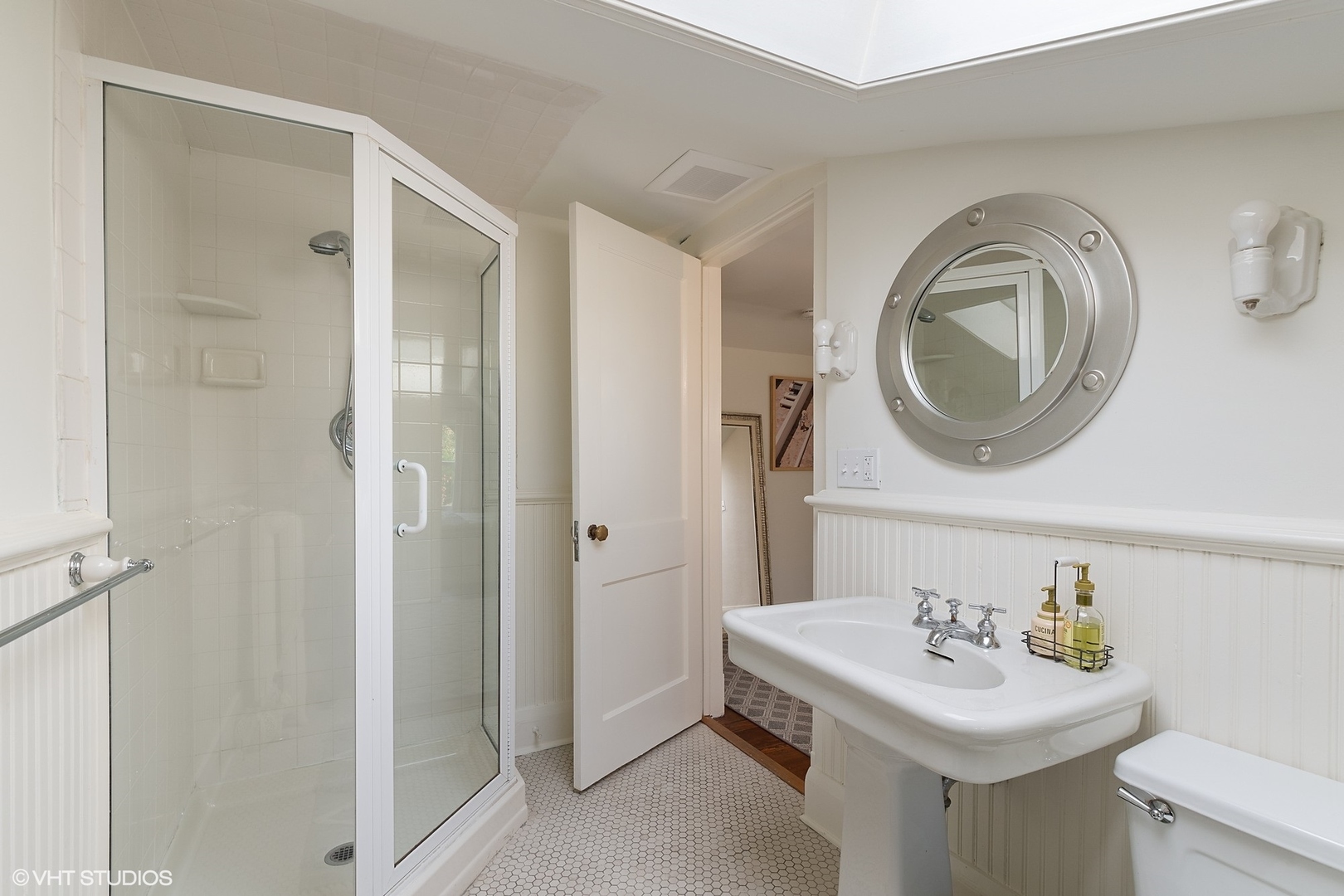 9 Warwick Road Winnetka, IL 60093 - Photo 45 of 54 a bathroom with a sink a toilet and a mirror