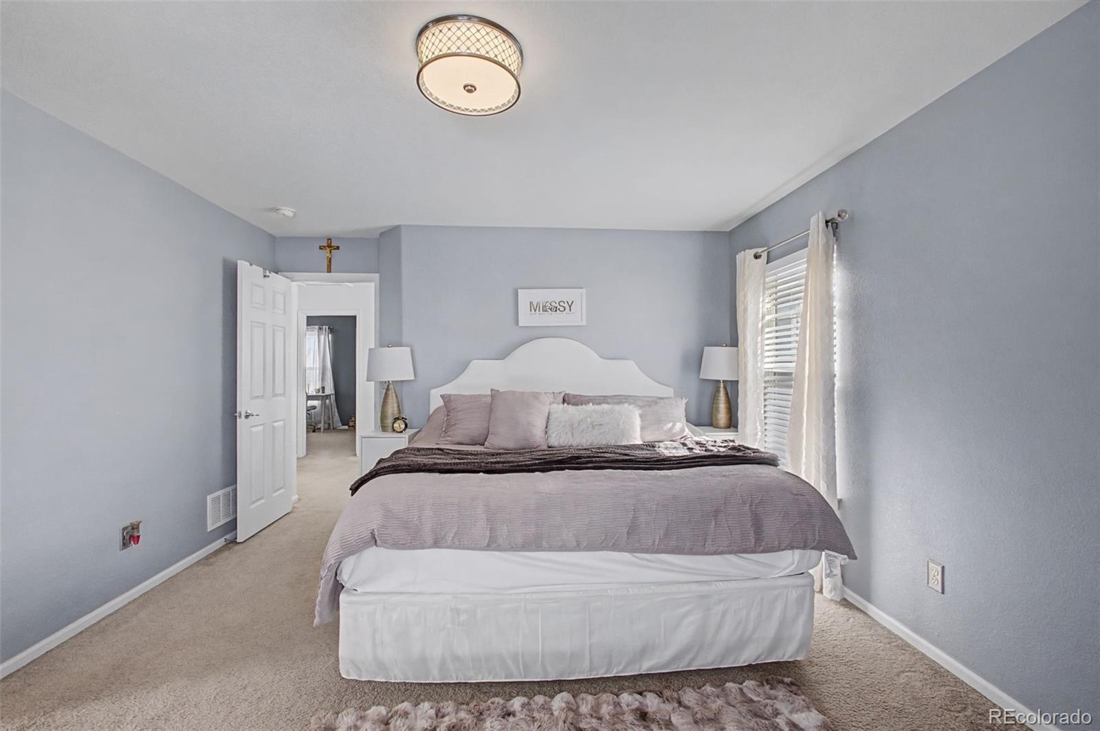 2921 Fulton Street Denver, CO 80238 - Photo 19 of 42 a large white bed in a white room