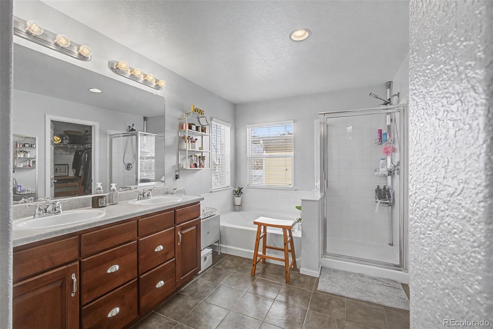 2921 Fulton Street Denver, CO 80238 - Photo 22 of 42 a spacious bathroom with a double vanity sink mirror and double