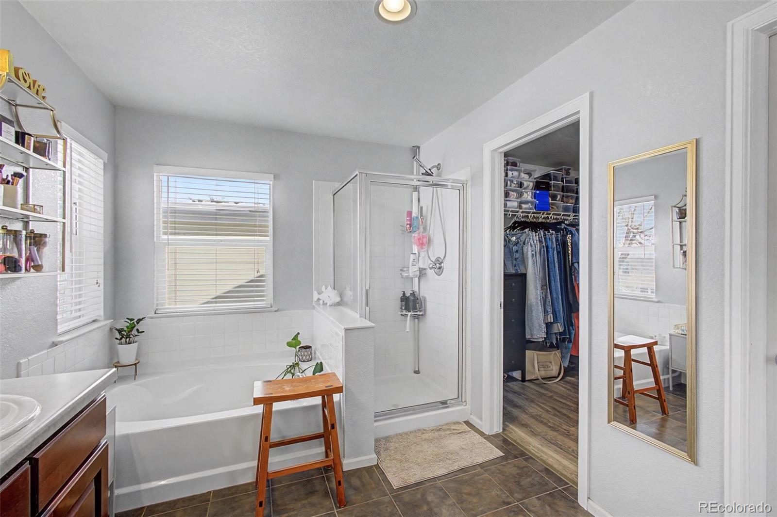 2921 Fulton Street Denver, CO 80238 - Photo 23 of 42 a bathroom with a tub and shower